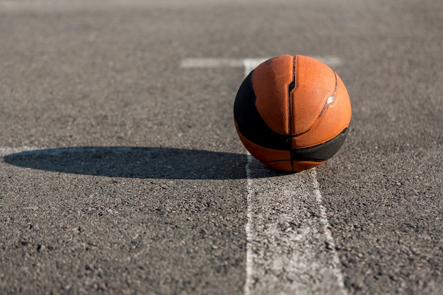 Front view basketball on asphalt