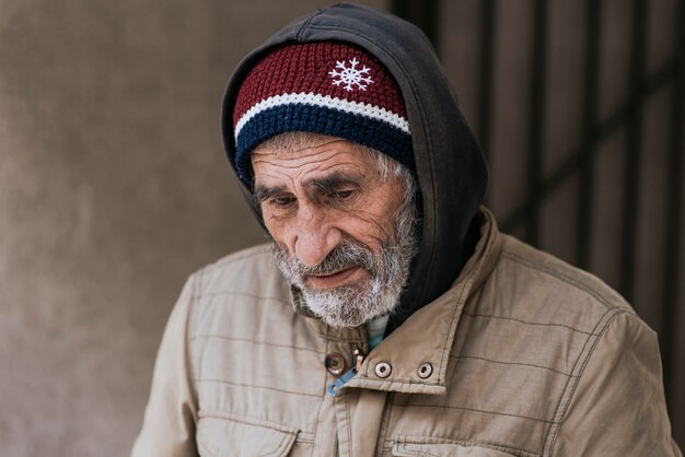 Front view of bearded homeless man