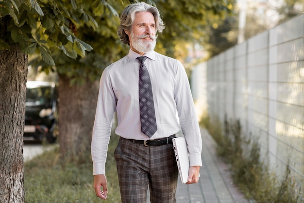 Free photo front view bearded mature man walking