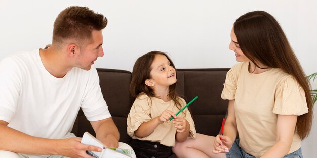 Front view beautiful family chatting