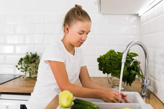 Front view of beautiful girl cooking