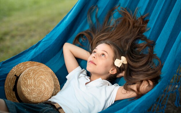 Front view of beautiful girl in hammock