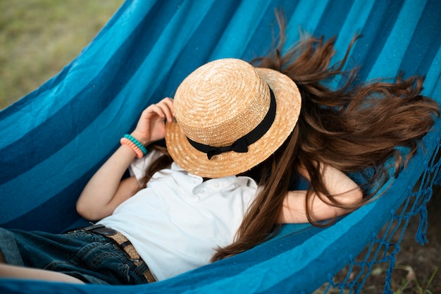 Front view of beautiful girl in hammock