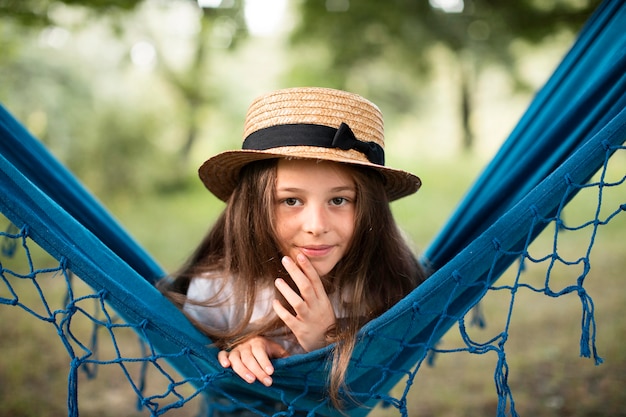 Front view of beautiful girl in hammock