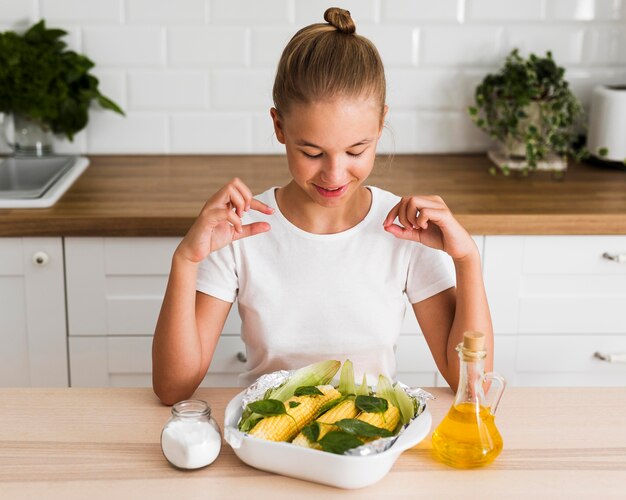 Front view of beautiful girl in the kitchen