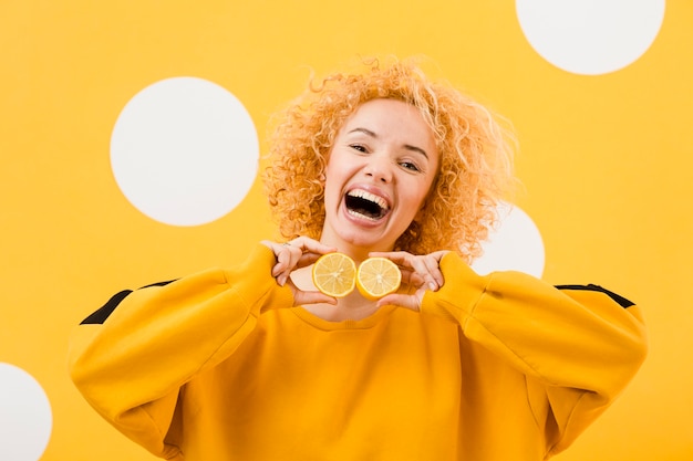 Front view of beautiful girl with lemon slices