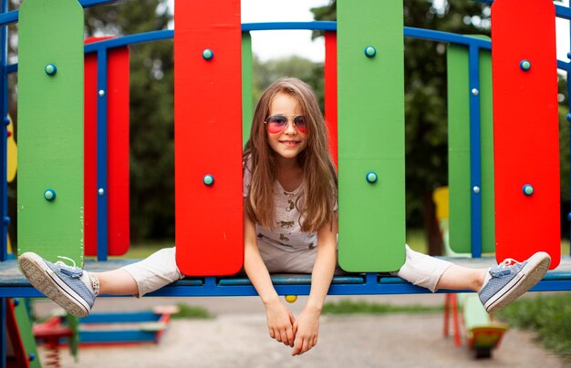 Front view of beautiful happy girl in park