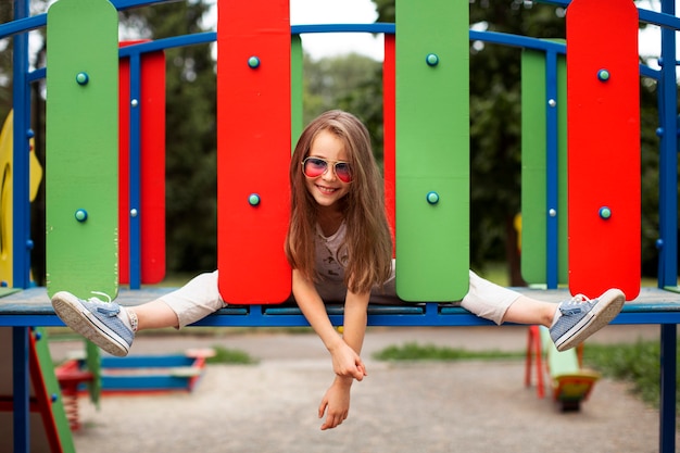 Front view of beautiful happy girl in park