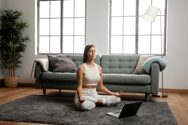 Front view of beautiful woman doing indoor activity