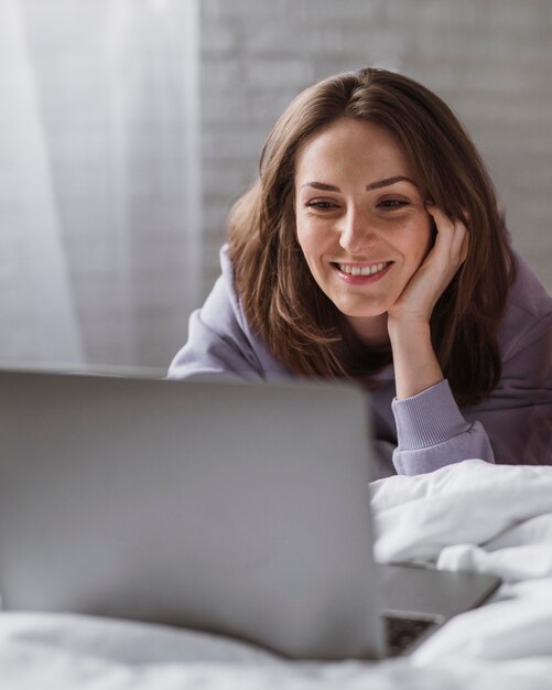 Front view of beautiful woman on laptop