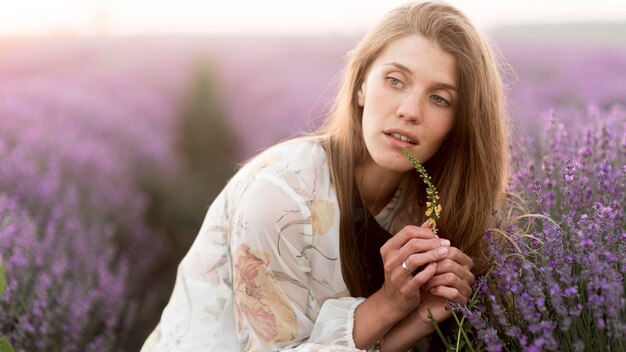 front view of beautiful woman in nature