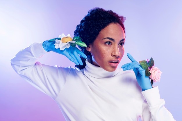 Front view of beautiful woman posing with floral gloves