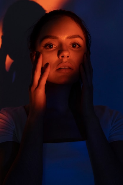 front view beautiful woman shooting with projector