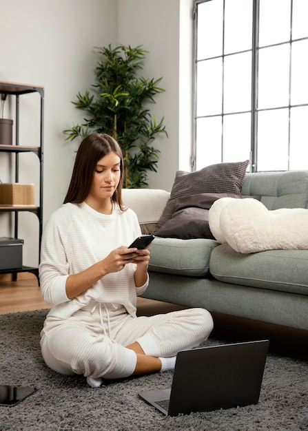 Free photo front view of beautiful woman staying on laptop