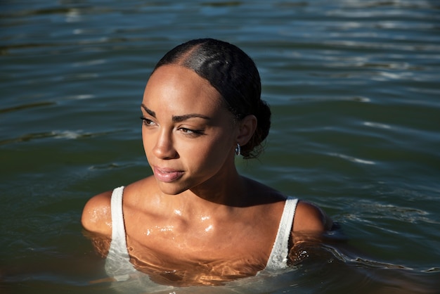 Free photo front view beautiful woman swimming