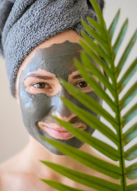 Front view of beautiful woman wearing face mask