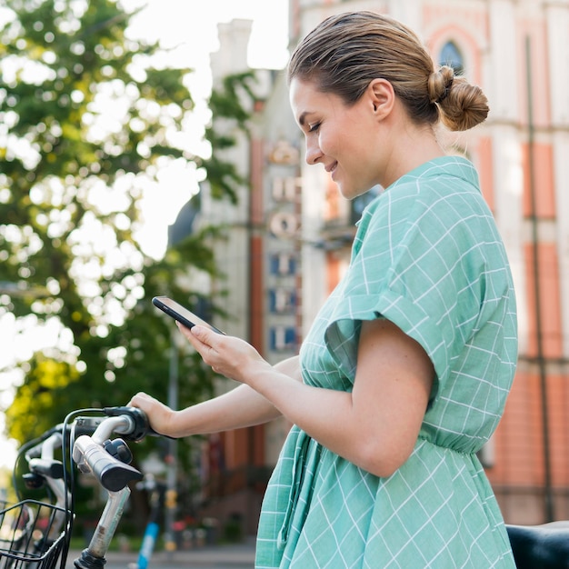 Front view of beautiful woman with bicycle