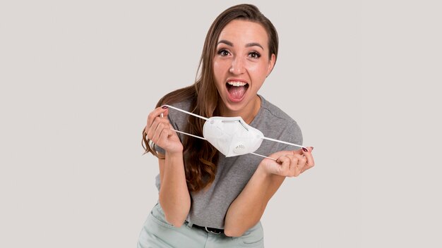 Front view of beautiful woman with face mask