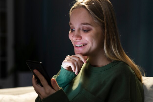 Front view of beautiful woman with phone