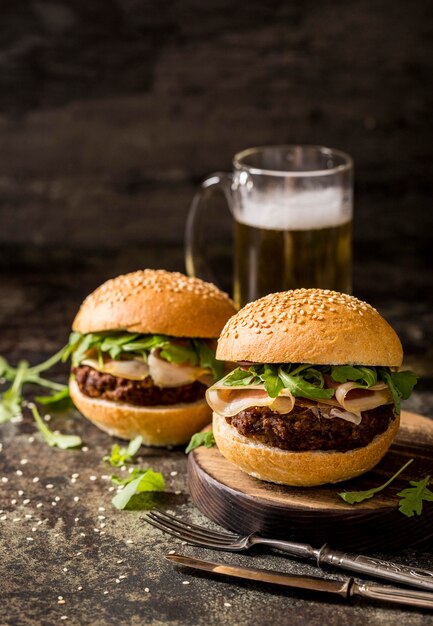 Front view beef burgers with bacon and beer