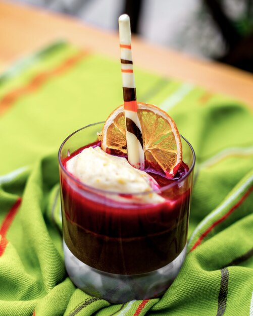 Front view berry souffle dessert with a slice of dried orange