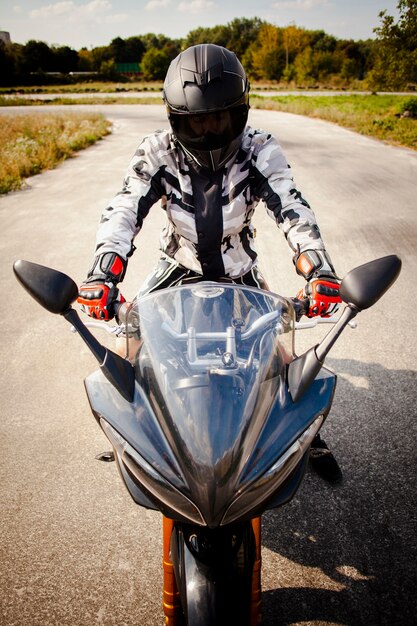 Front view of a biker on the road