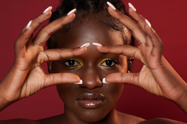 Front view black woman posing in studio