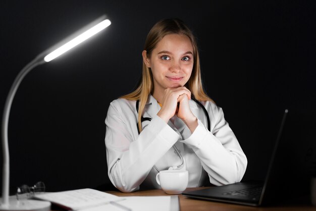 Front view of blonde woman at night