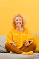 Free photo front view of blonde woman with book