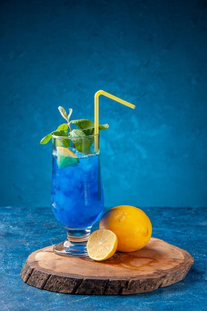 Front view blue cool lemonade with ice on blue background fruit cold cocktail drink color bar juice
