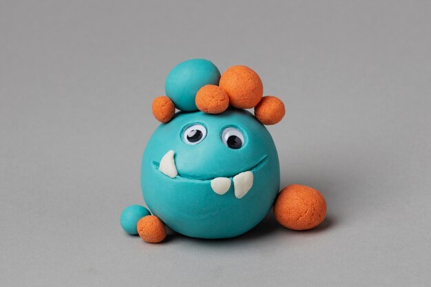 Front view blue play dough monster