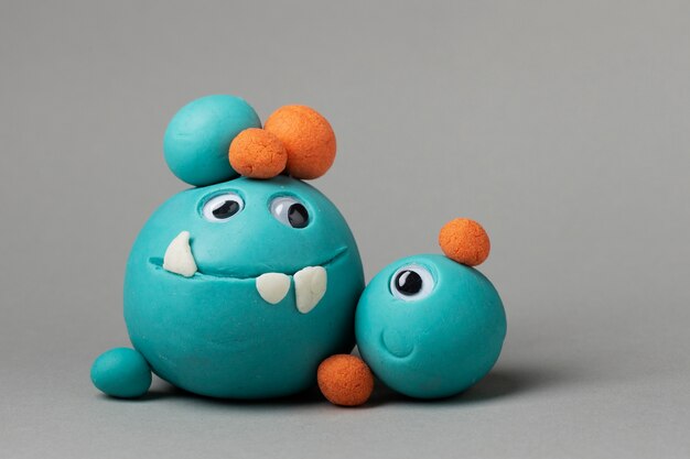 Front view blue play dough monsters