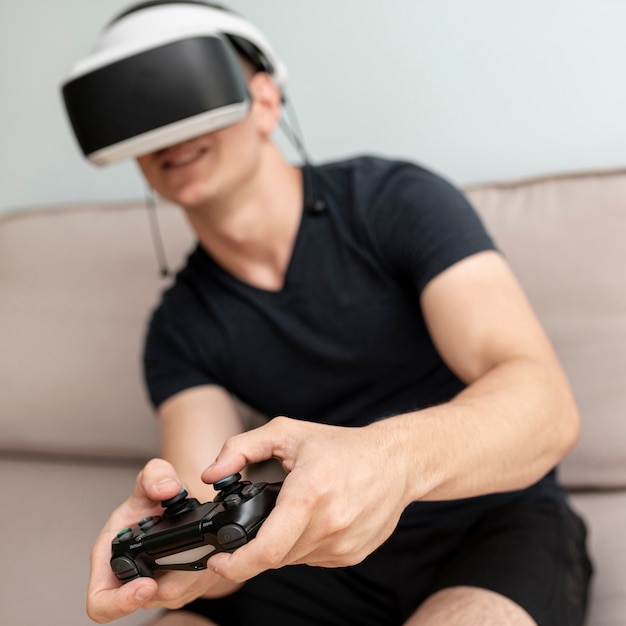 Front view blurred teenager with controller