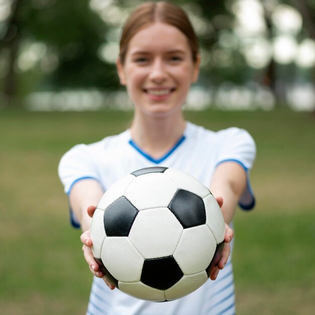 Front view blurred woman holding ball