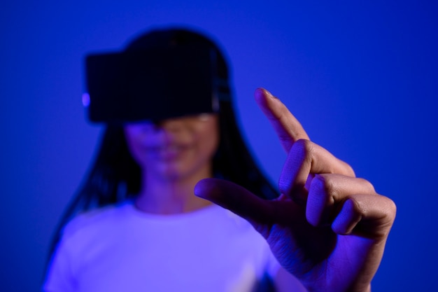 Front view blurry woman wearing vr glasses