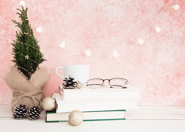 Front view of books and glasses on wooden table