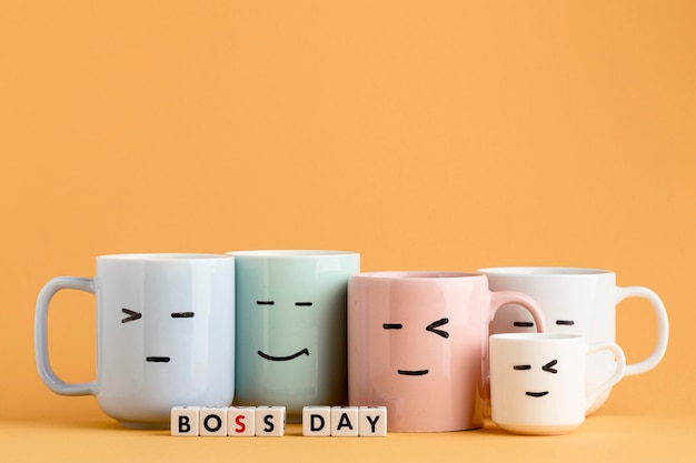 Front view of boss day concept with cups