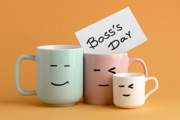 Front view of boss day concept with cups