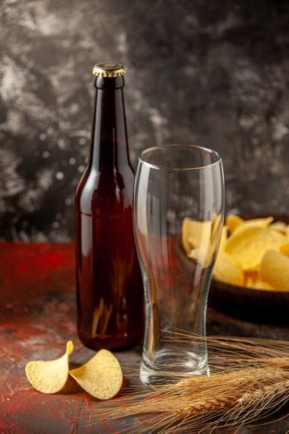 Front view bottle of bear with cips on dark background