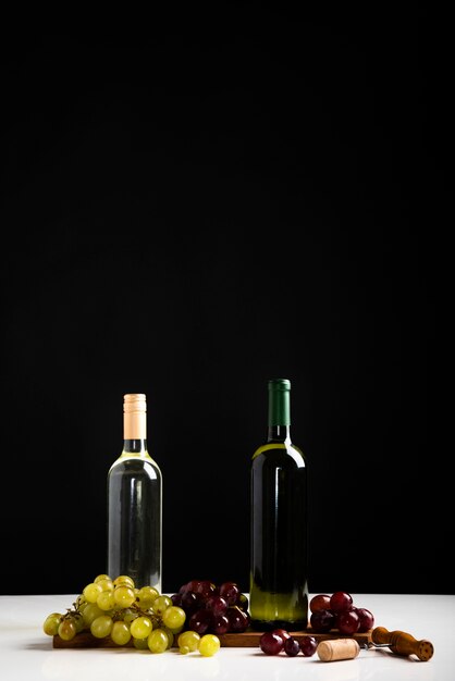 Front view bottles of wine with black background