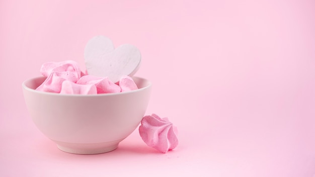 Front view of bowl of meringue with heart