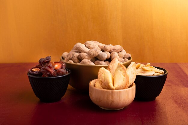 Front view of bowl of peanuts and other delicacies for chinese new year