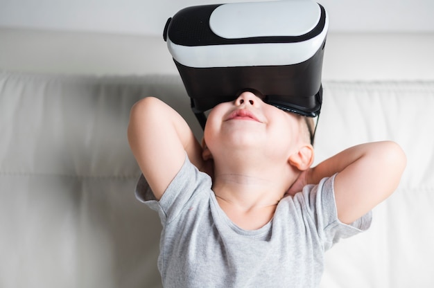 Front view boy enjoying a pair of vr headset