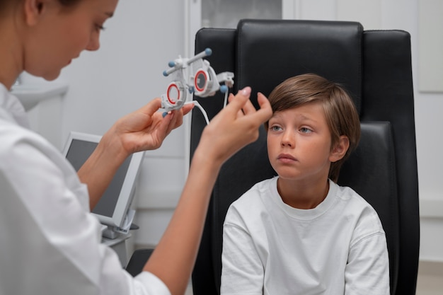 Front view boy at eye's checkup