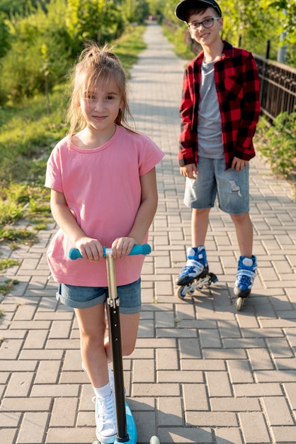 Front view of boy and girl in park