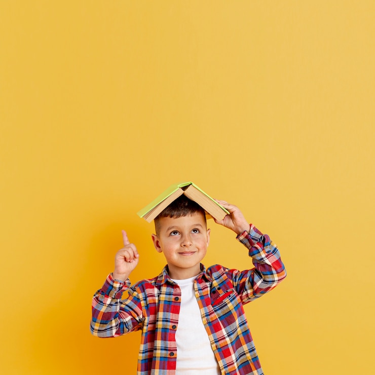 Free Photo front view boy holding book on his head