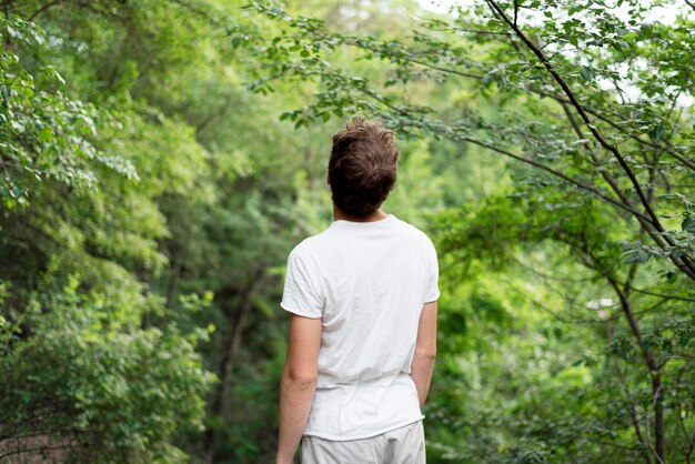 Front view of boy in nature