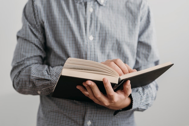 Front view boy reading a holy book