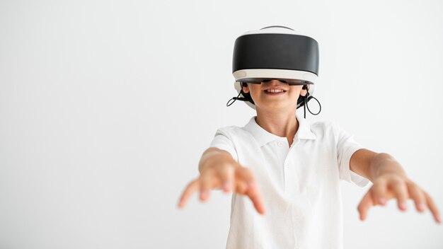 Front view boy wearing virtual reality glasses