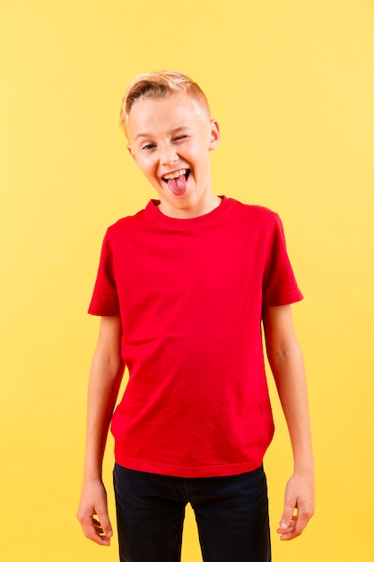 Front view boy winking and showing tongue